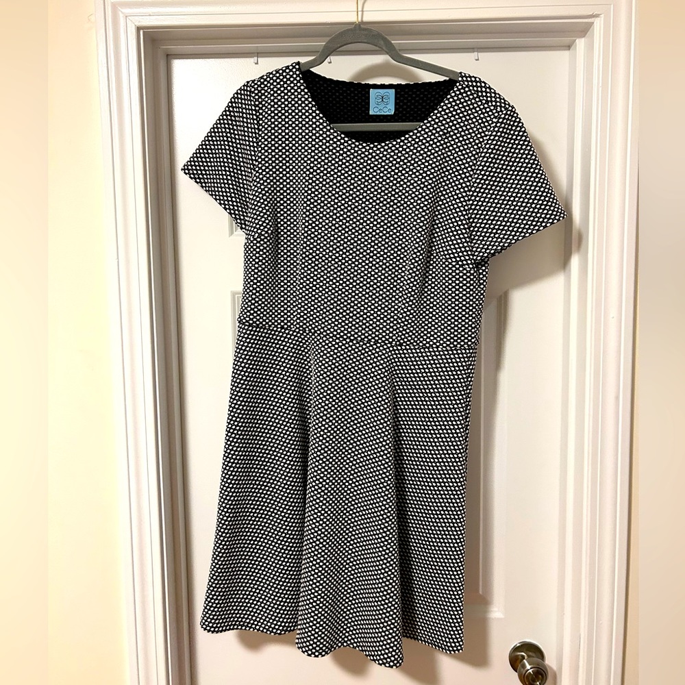 Black short sleeve dress with white polka dots